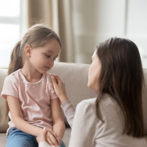 Mother discussing downward deviation of child support with a young daughter - Greenberg Legal Group